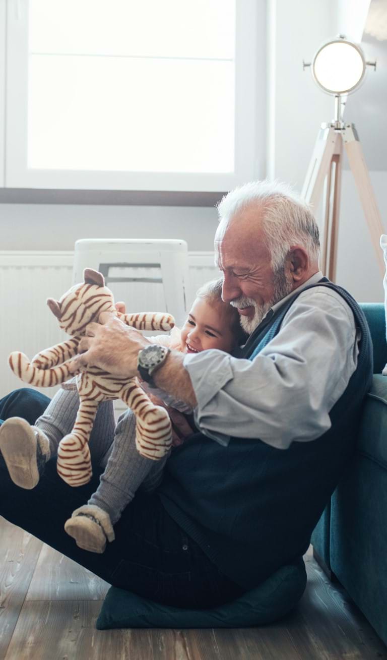 Grandfather playing with his granddaughter | Discover Kaleido's RESPs