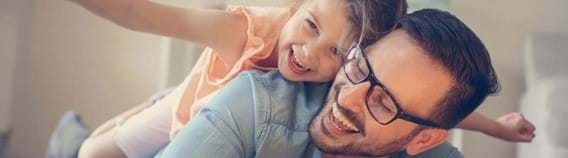 Dad with daughter on his back inside | Discover Kaleido's RESPs